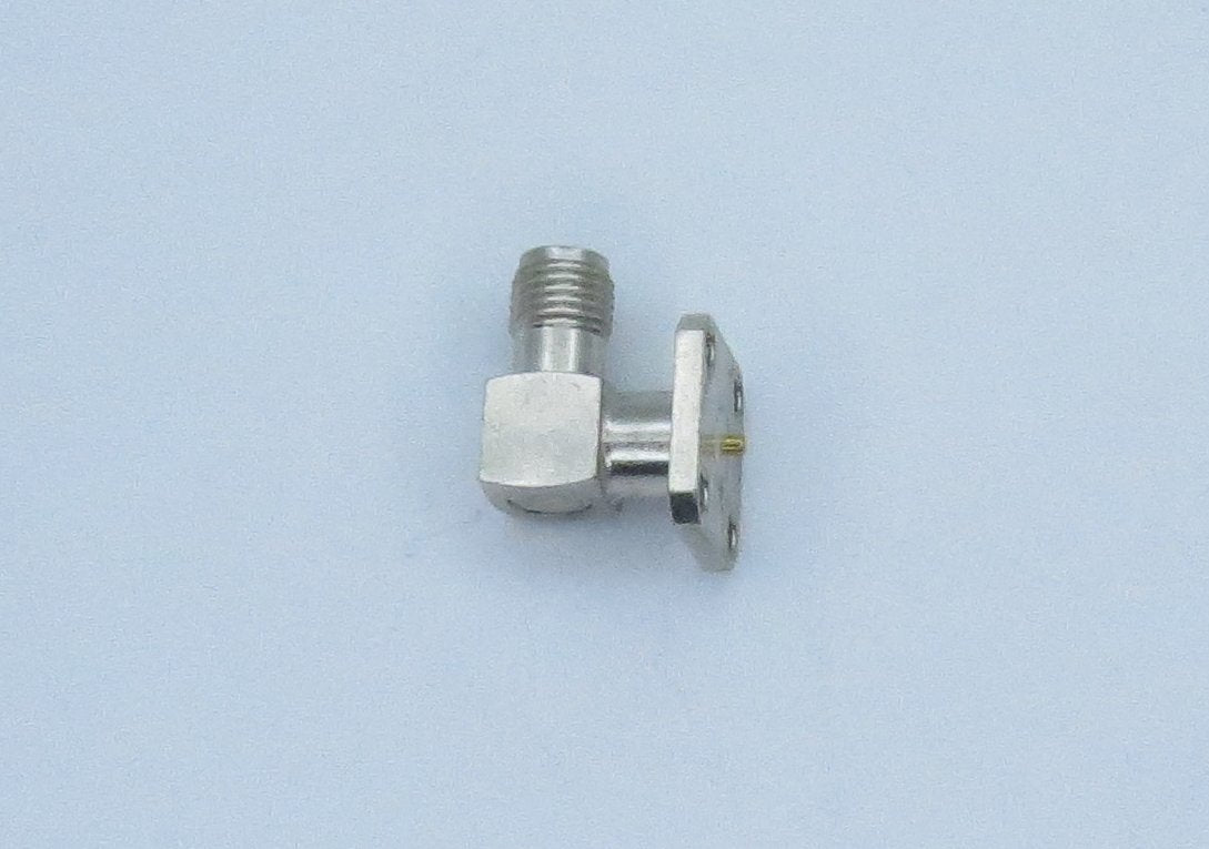 Con, SMA vertical bulkhead PCB jack, 26.5 mm overall length. Gold plated brass, teflon dielectric. RoHS Compliant.